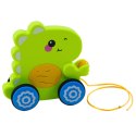 LEAN Toys Dinozaur Na Sznurku Jeżdżący Do Ciągnięcia Dla Malucha Grzechotka Zielony